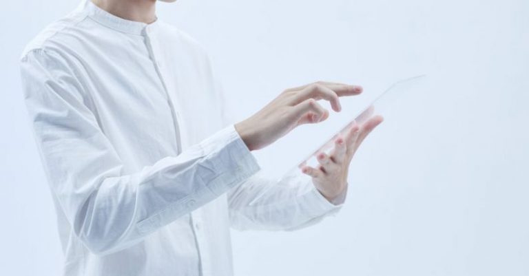 Automation Insights - A Person in White Long Sleeves Holding a Clear Glass