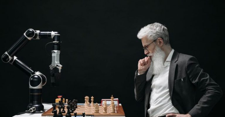 Technology Innovation - Elderly Man Thinking while Looking at a Chessboard