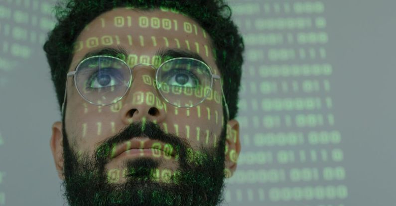 Cybersecurity Measures - Man With Binary Code Projected on His Face