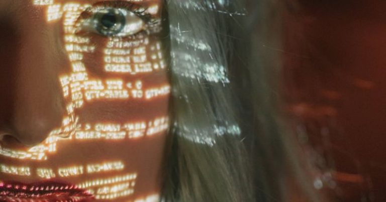 Cybersecurity Measures - Woman With Text Projected on Her Face
